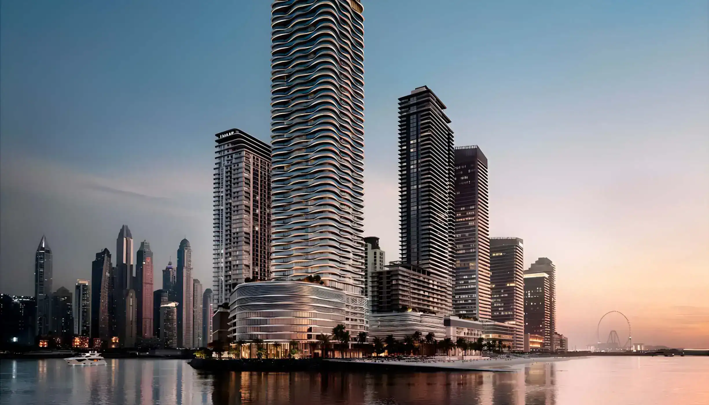 Emaar Beachfront tengerparti lakótornyainak látványterve Dubajban naplementében